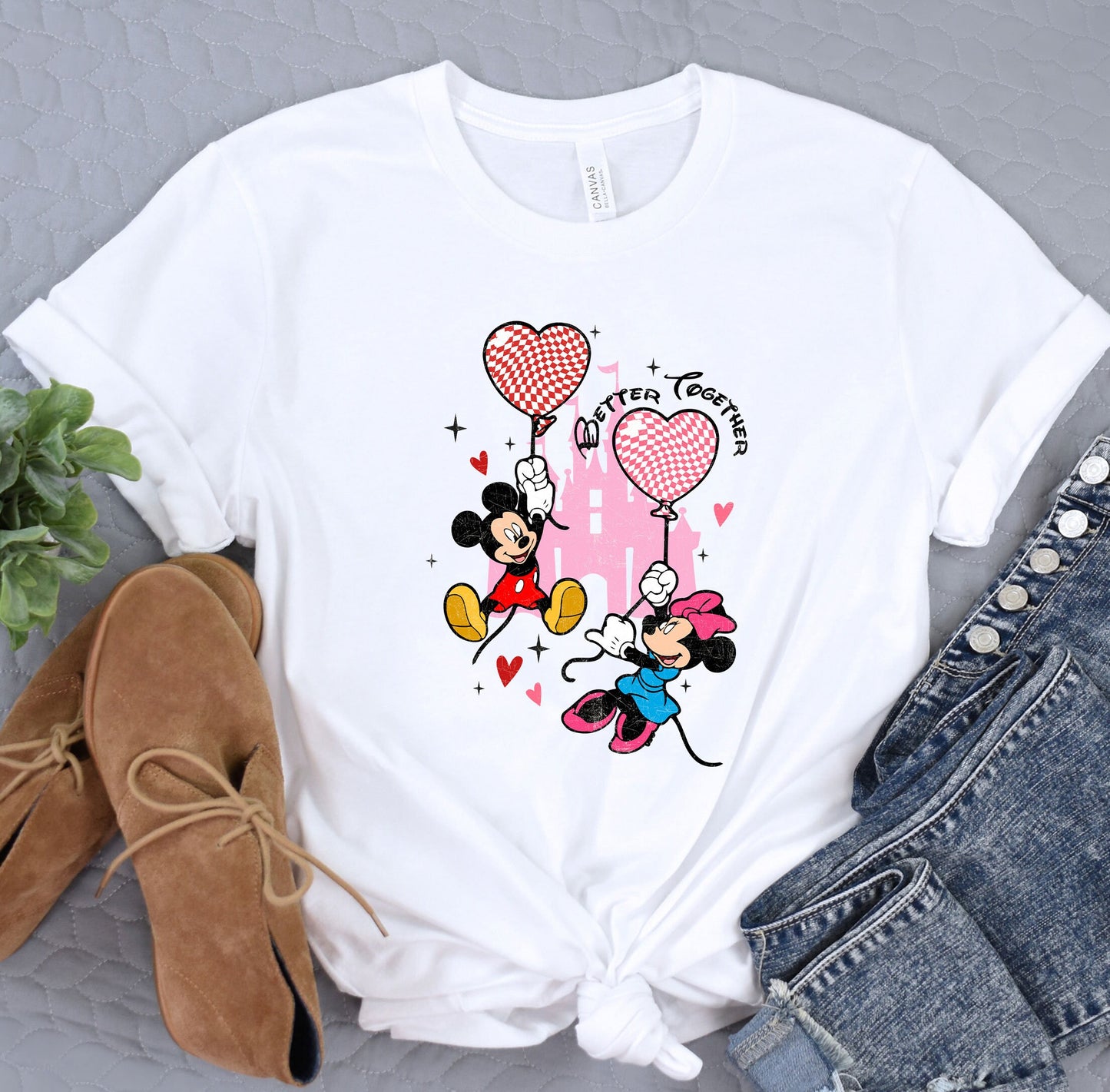 a white shirt with a mickey mouse and minnie mouse on it