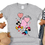 a t - shirt with a mickey mouse and minnie mouse on it