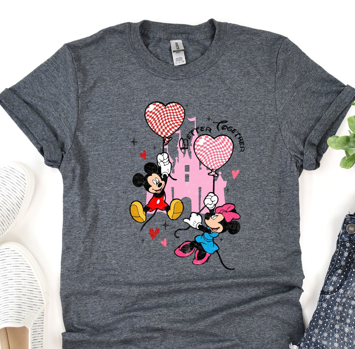 a t - shirt with a mickey mouse and minnie mouse on it