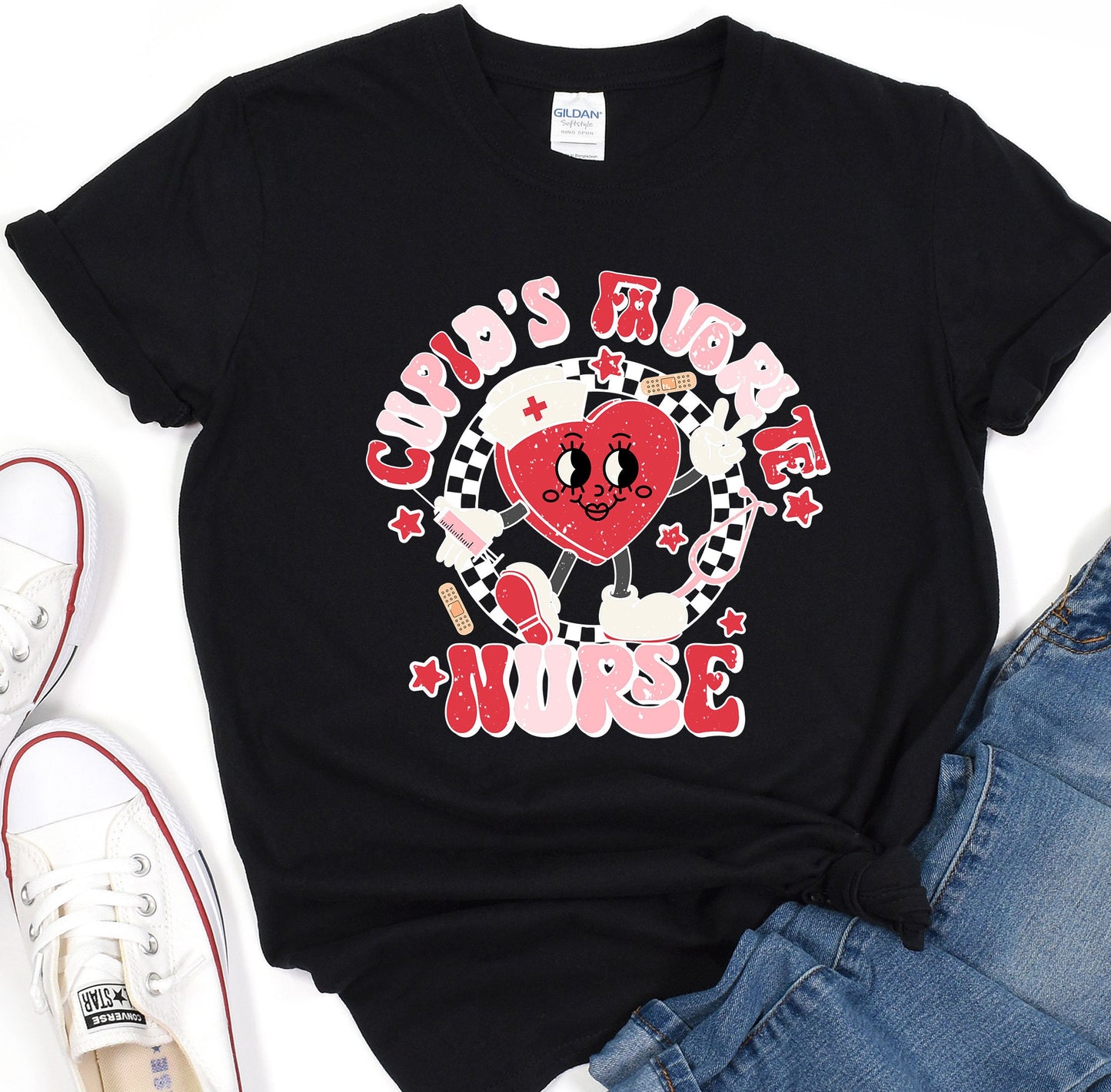 a black t - shirt with a red heart on it