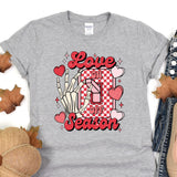 a t - shirt that says love is in the air