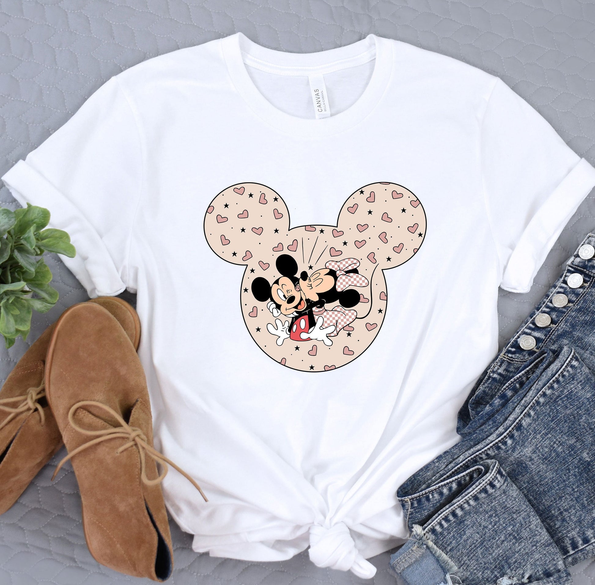 a mickey mouse t - shirt with hearts on it