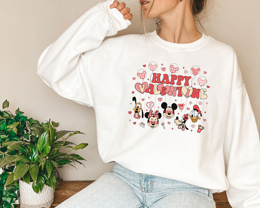 a woman wearing a mickey mouse happy birthday sweatshirt