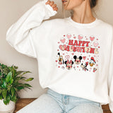 a woman wearing a mickey mouse happy birthday sweatshirt
