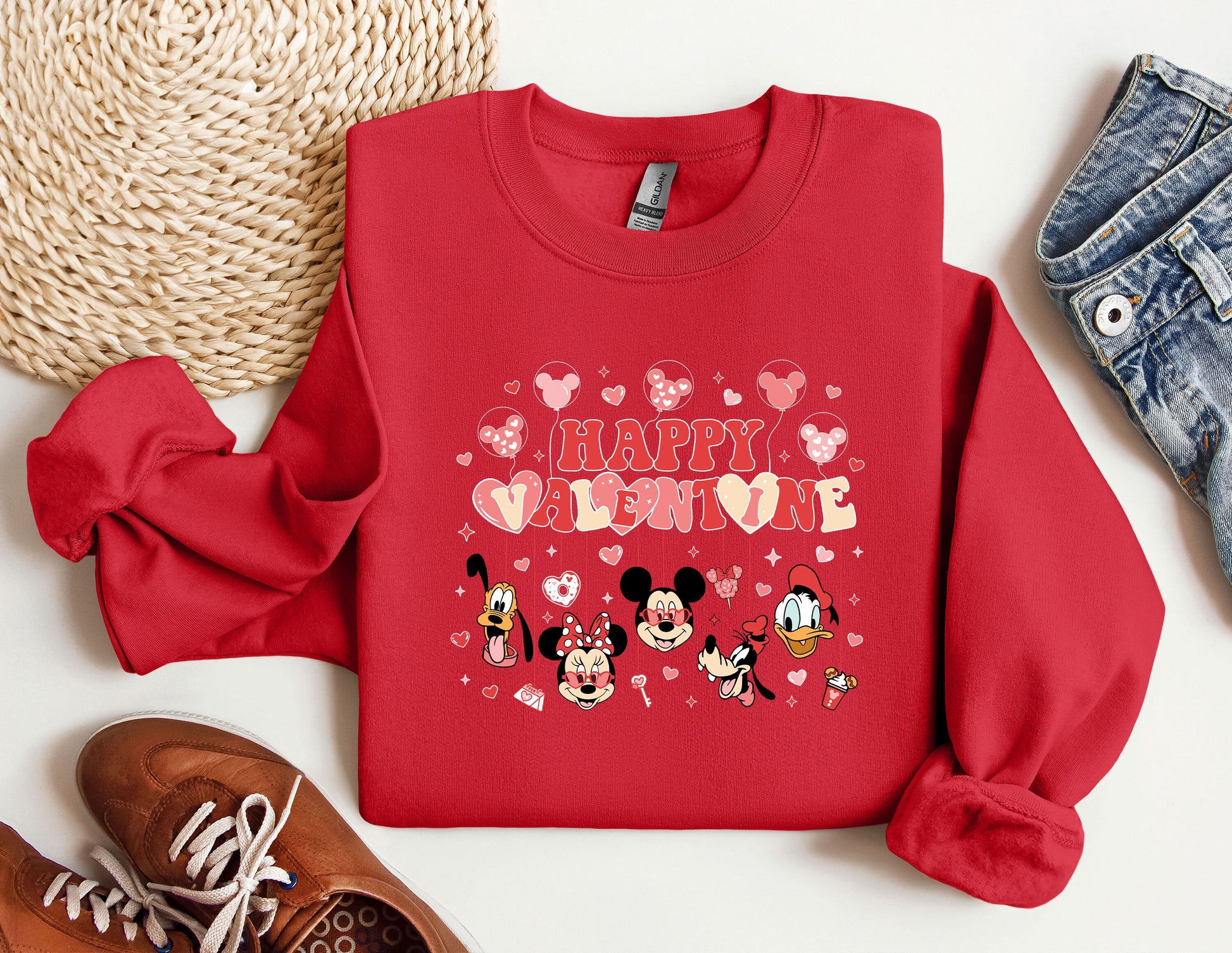 a red shirt with a mickey mouse design on it