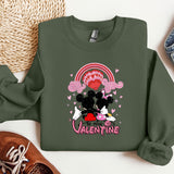 a green sweatshirt with a minnie mouse on it