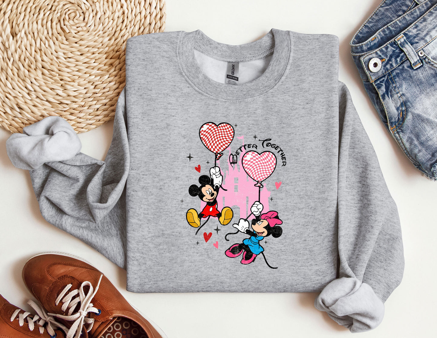 a gray sweatshirt with a mickey mouse design on it