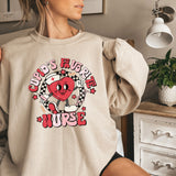 a woman wearing a sweatshirt with a heart on it