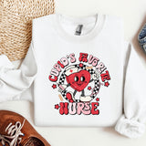 a white shirt with a red heart on it