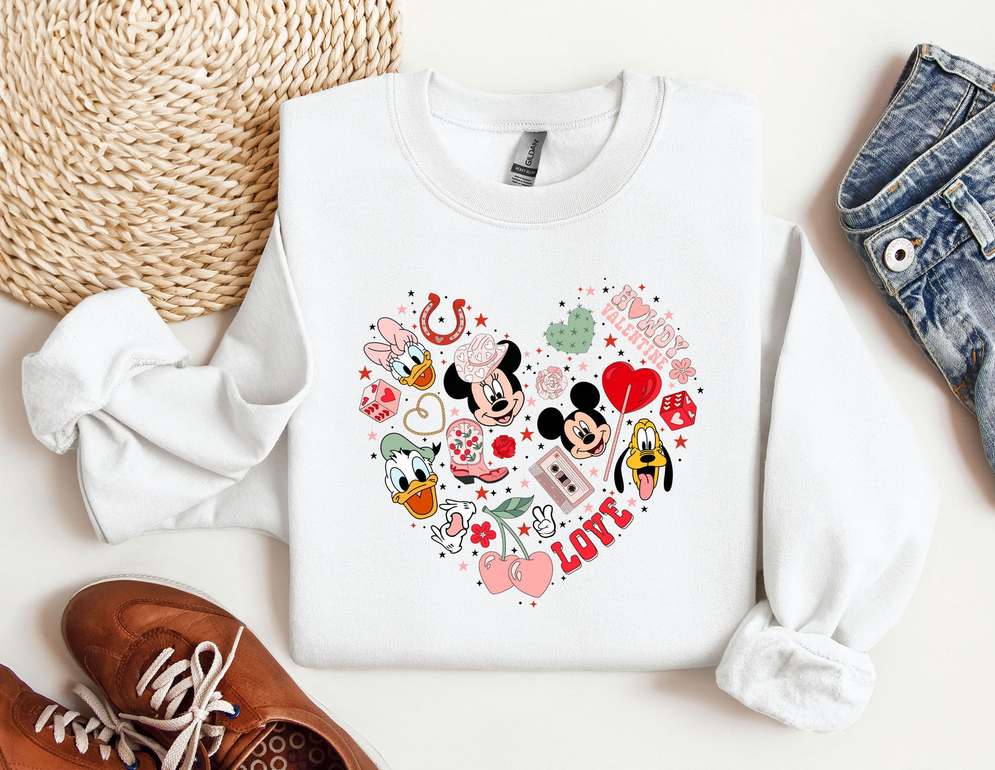 a white shirt with mickey and minnie mouses on it