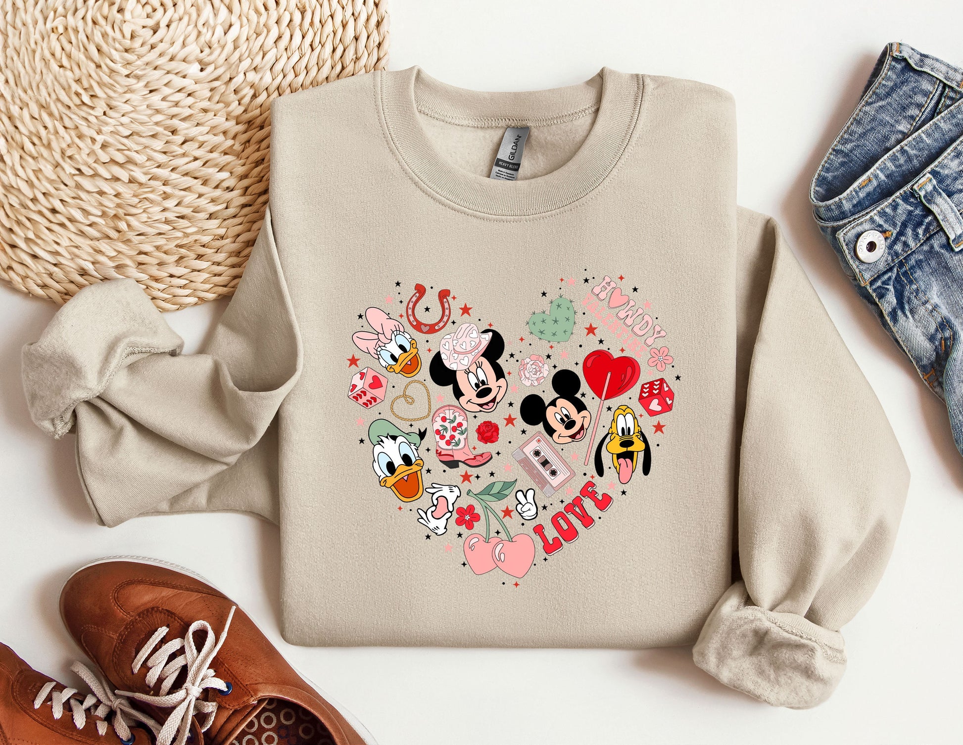 a pair of shoes and a sweater with mickey mouses on it