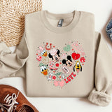a pair of shoes and a sweater with mickey mouses on it