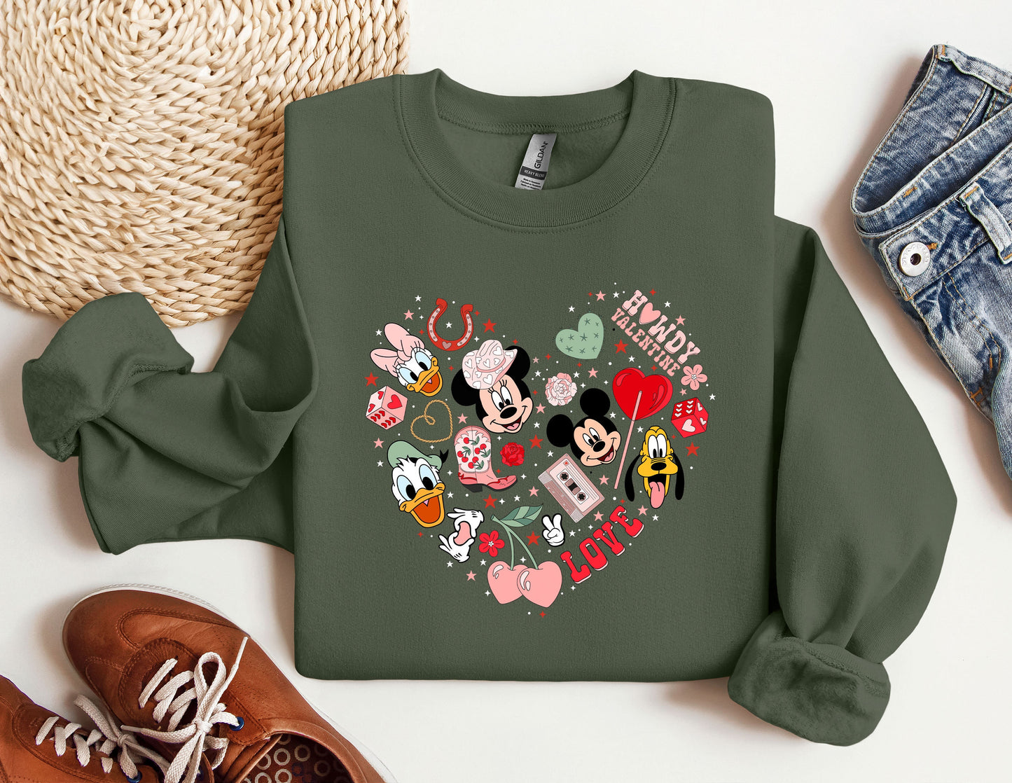 a green sweatshirt with a mickey mouse heart on it