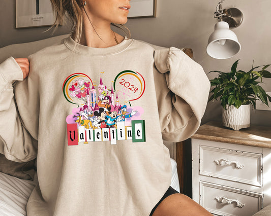 a woman wearing a mickey mouse sweatshirt with the word valentine on it