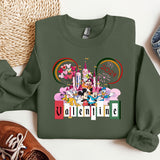 a green sweatshirt with mickey mouse and friends on it