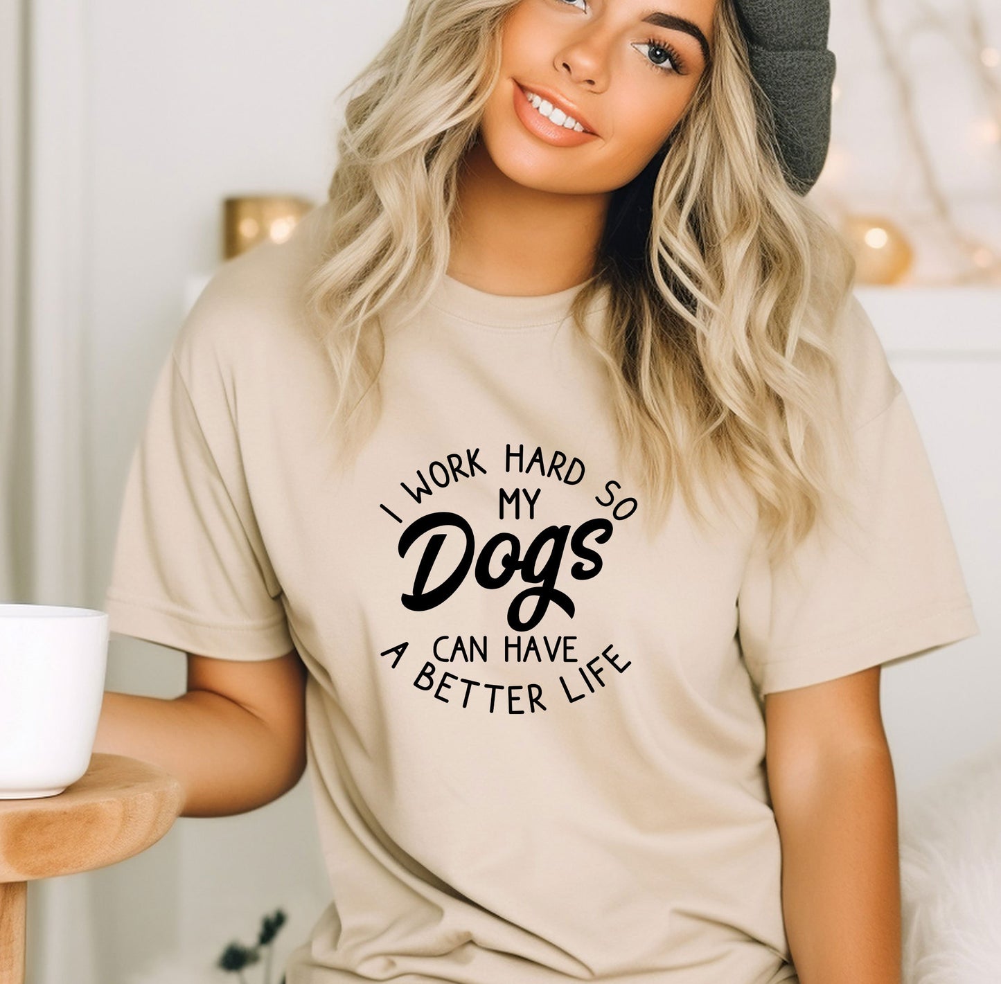 a woman wearing a t - shirt that says i work hard so my dogs can