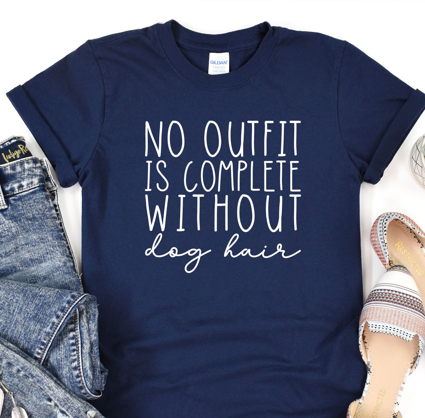 a t - shirt that says, no outfit is complete without dog hair