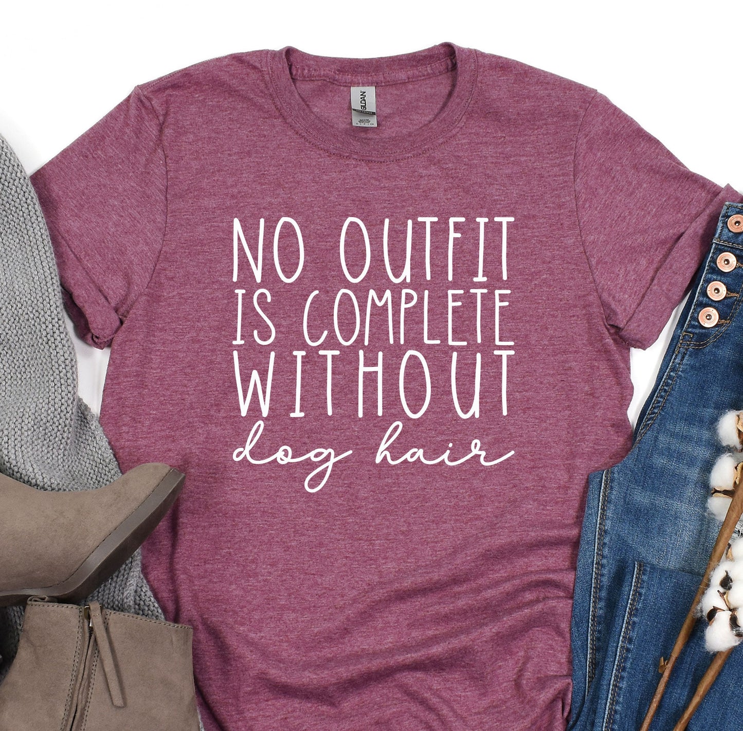 a t - shirt that says, no outfit is complete without dog hair