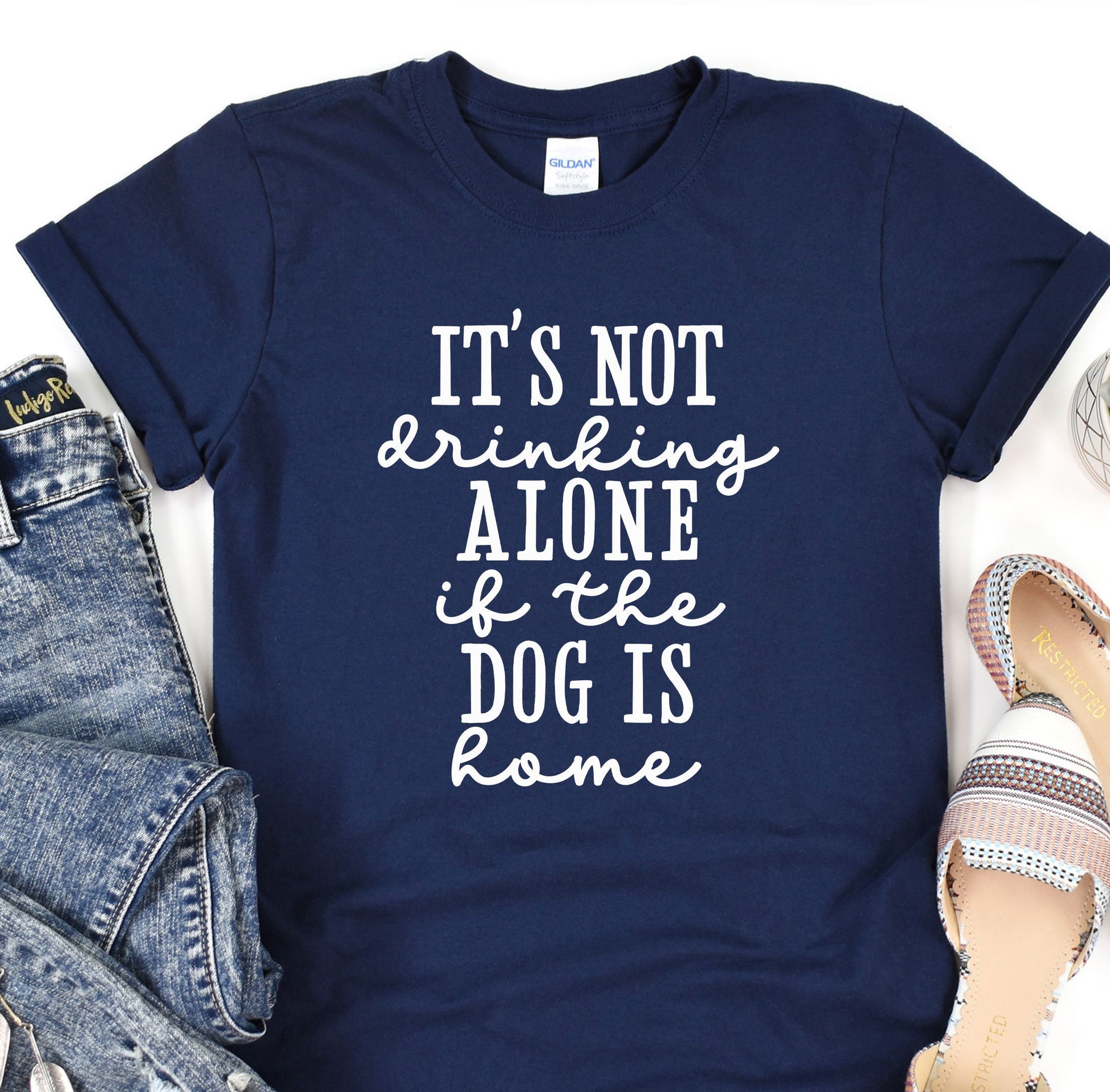 a t - shirt that says it&#39;s not drinking alone if the dog is