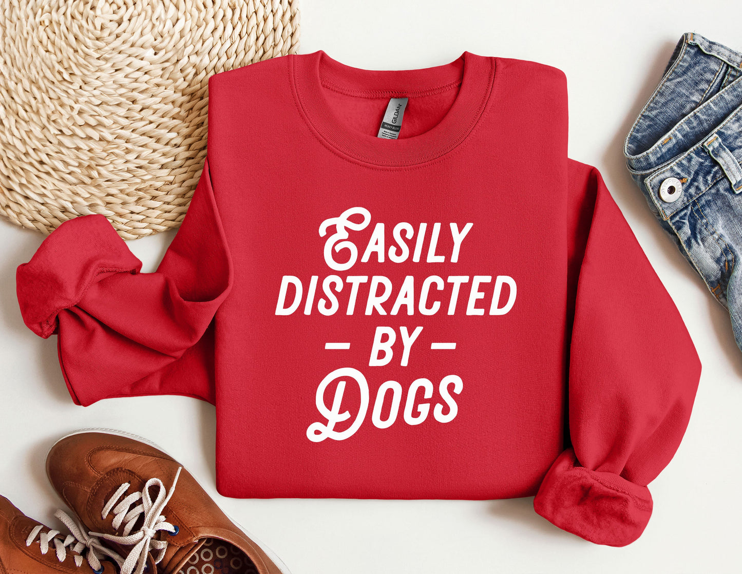 a red sweatshirt that says easily distracted by dogs