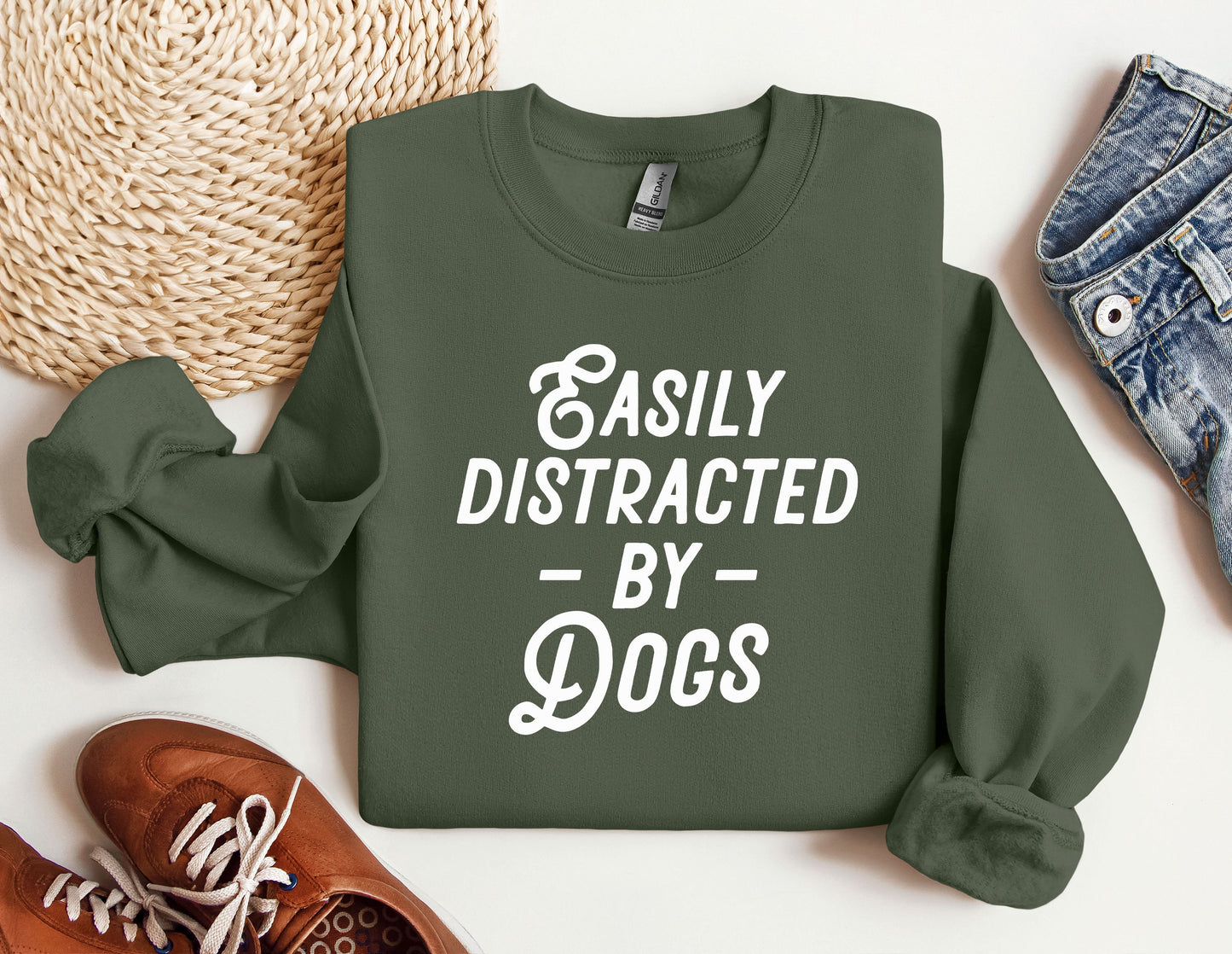 a green sweatshirt that says easily distracted by dogs