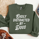 a green sweatshirt that says easily distracted by dogs