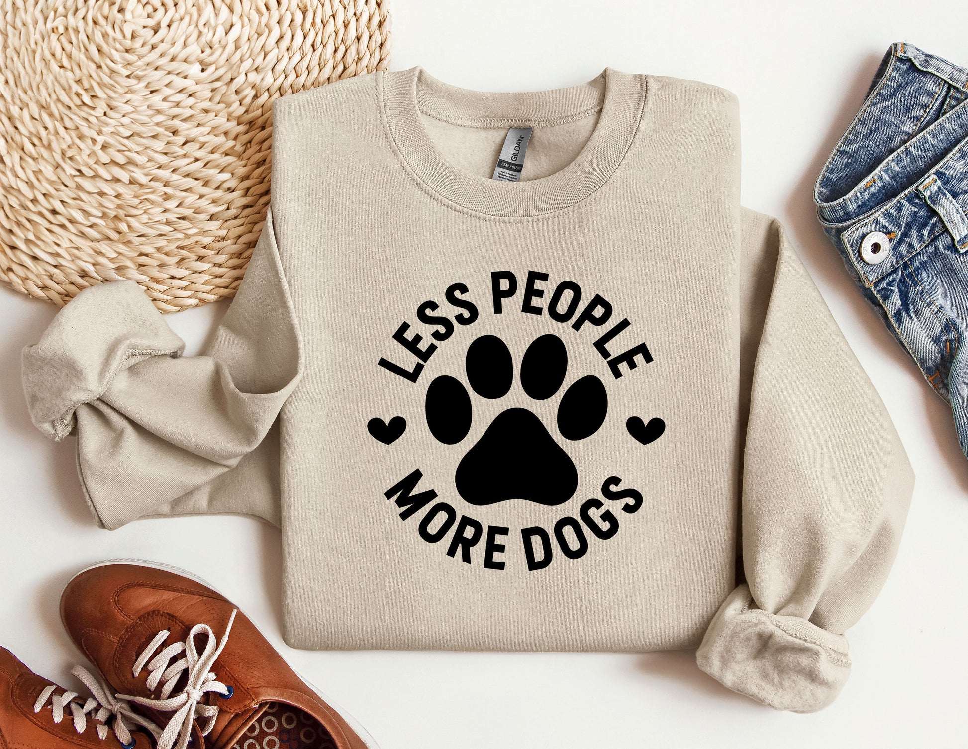 a sweater that says less people more dogs on it