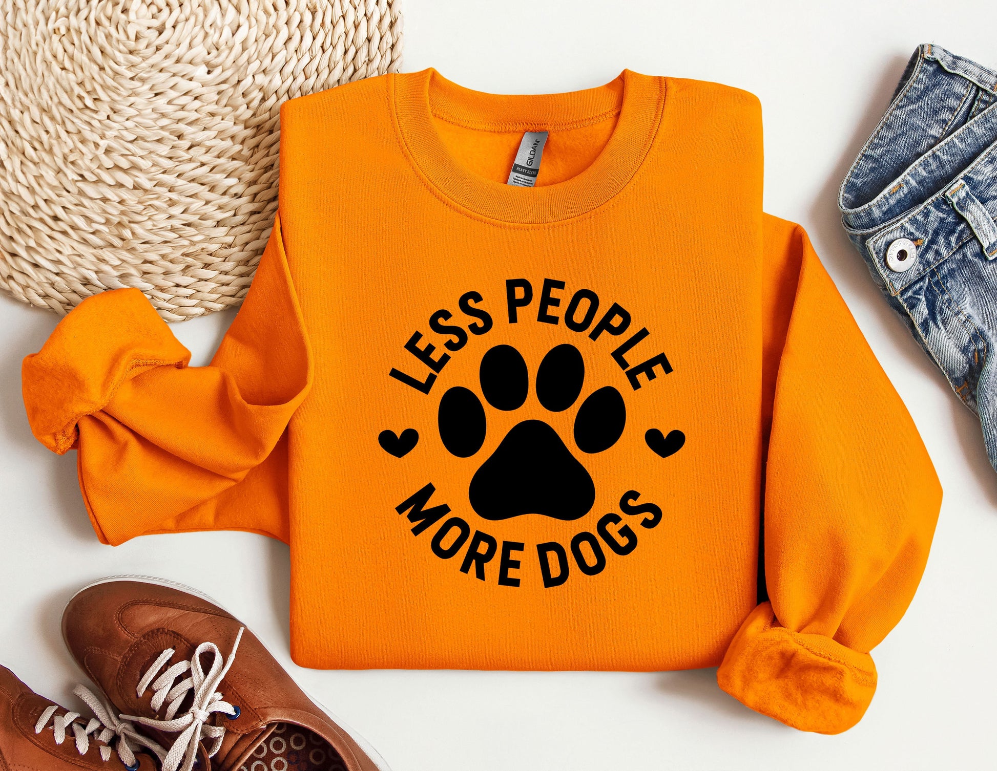 an orange shirt with a dog&#39;s paw on it