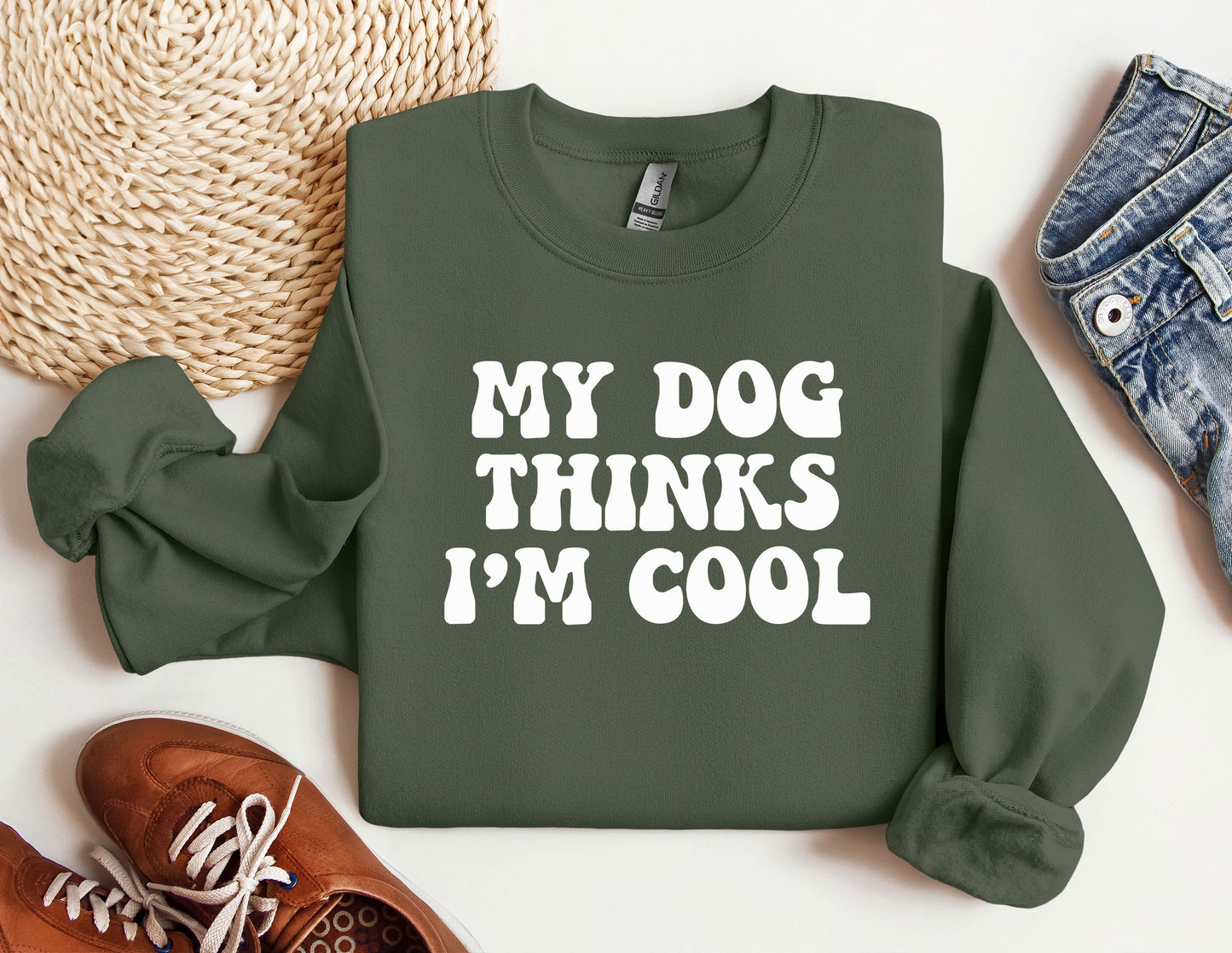 a green sweatshirt that says, my dog thinks i&#39;m cool