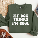 a green sweatshirt that says, my dog thinks i'm cool