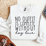 a white sweatshirt with a quote on it next to a pair of shoes