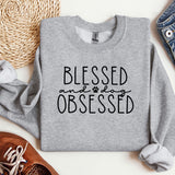 a sweatshirt with the words, blessing and dog obsesed printed on it