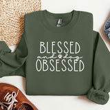 a green sweatshirt that says, blessing and dog obsesed