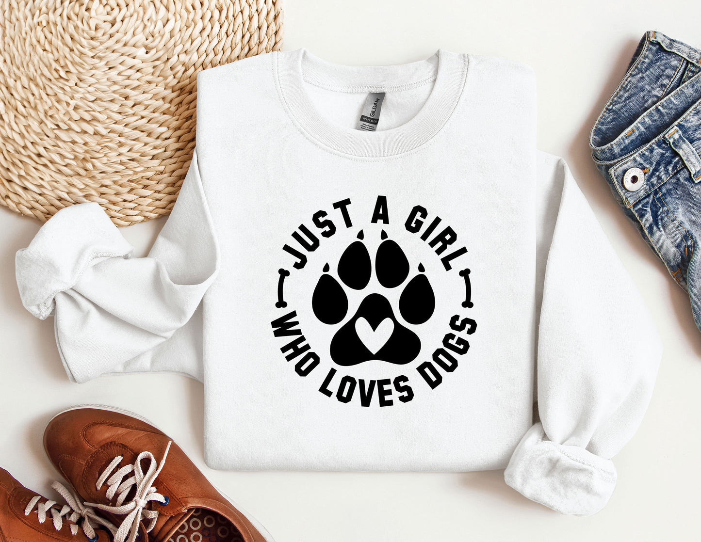 a white shirt with a dog paw on it