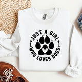 a white shirt with a dog paw on it