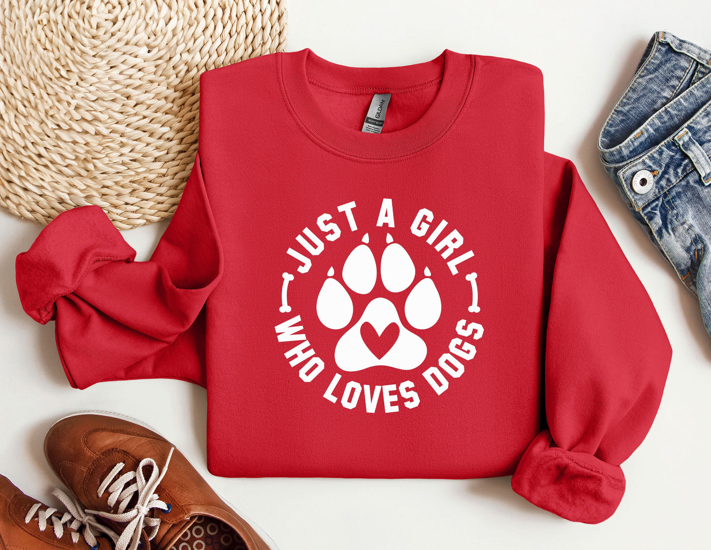 a red sweatshirt with a dog paw on it