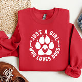 a red sweatshirt with a dog paw on it