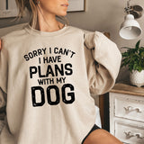 a woman wearing a sweatshirt that says sorry i can't i have plans with