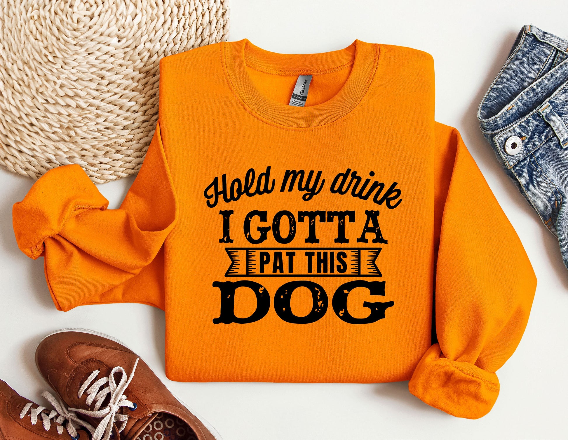 an orange sweatshirt that says i got a pat this dog