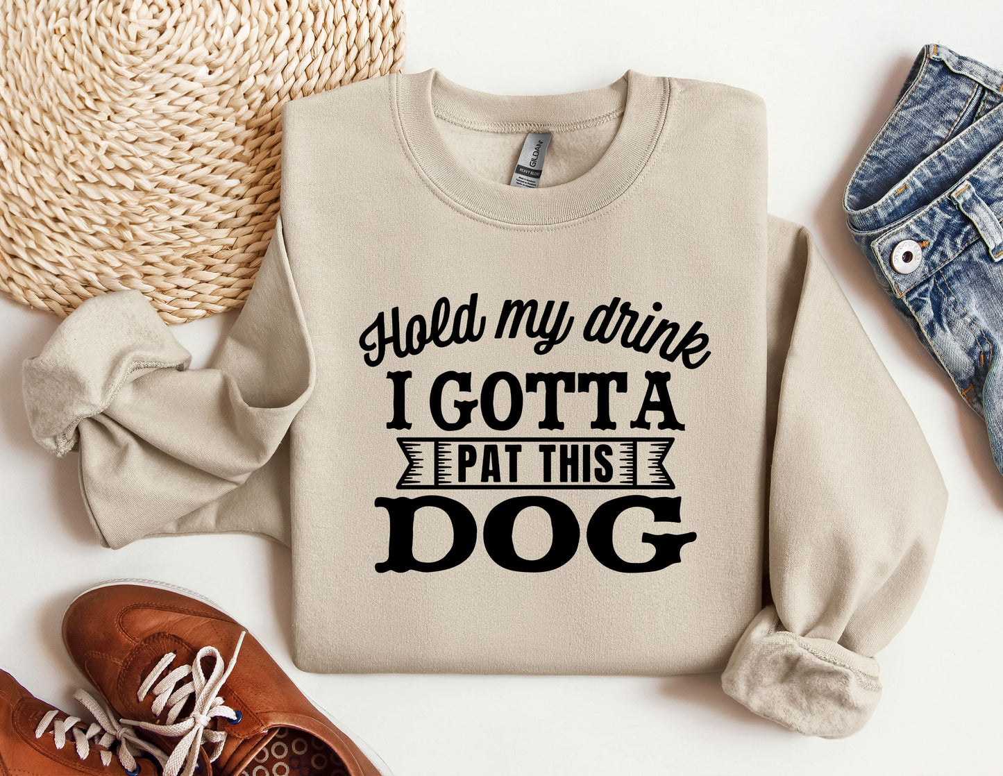 a sweater that says hold my drink i got a pat this dog