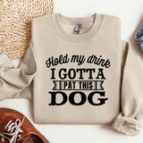 a sweater that says hold my drink i got a pat this dog