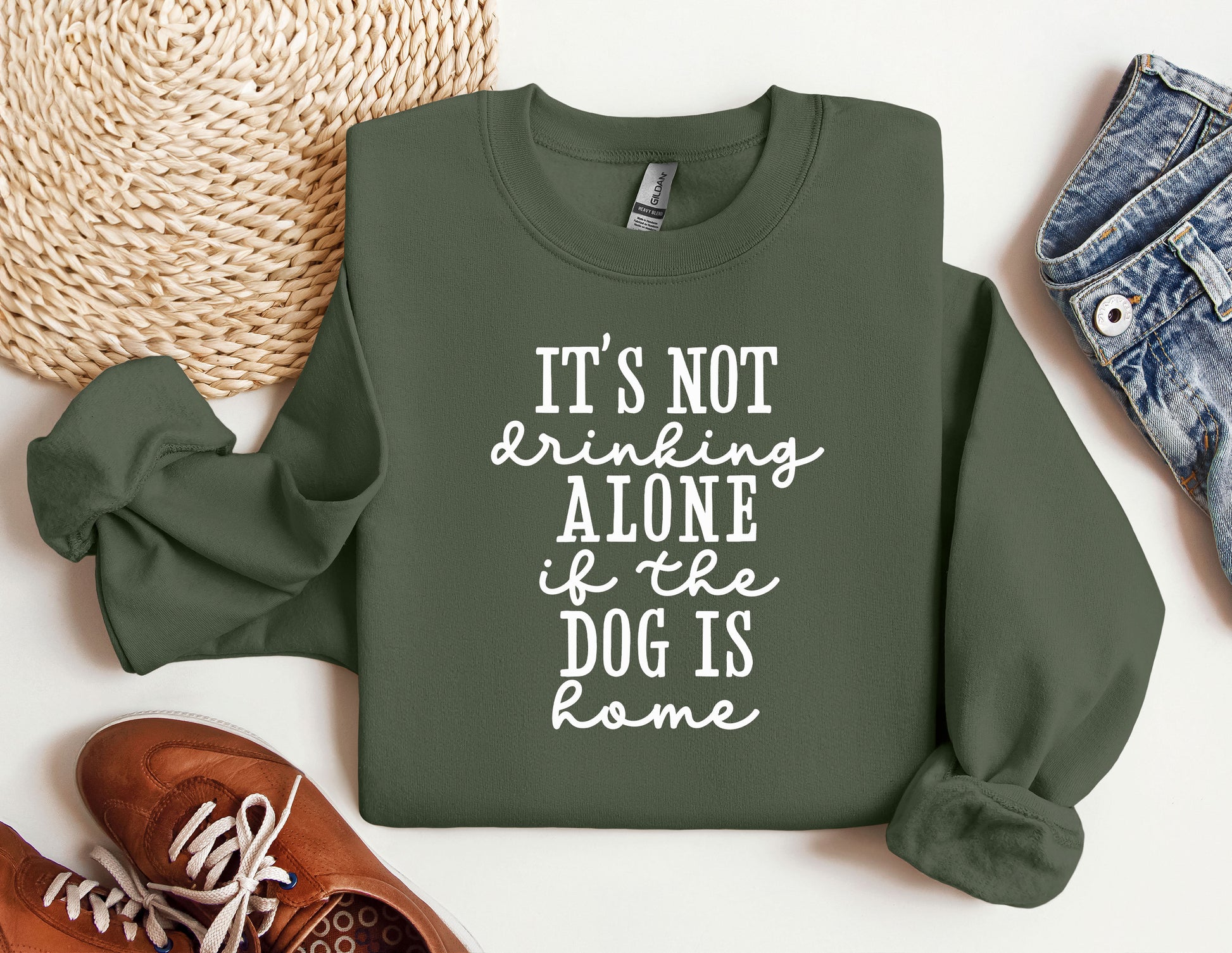 a green sweatshirt that says, it&#39;s not drinking alone if dog is bone