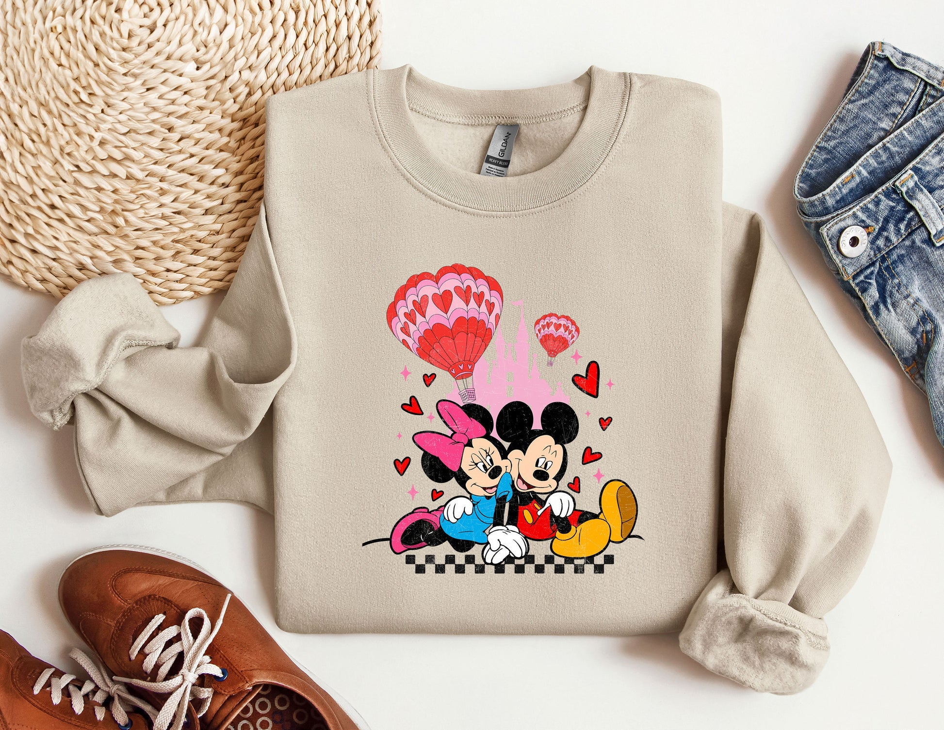 a sweater with a mickey and minnie mouse on it