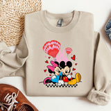 a sweater with a mickey and minnie mouse on it
