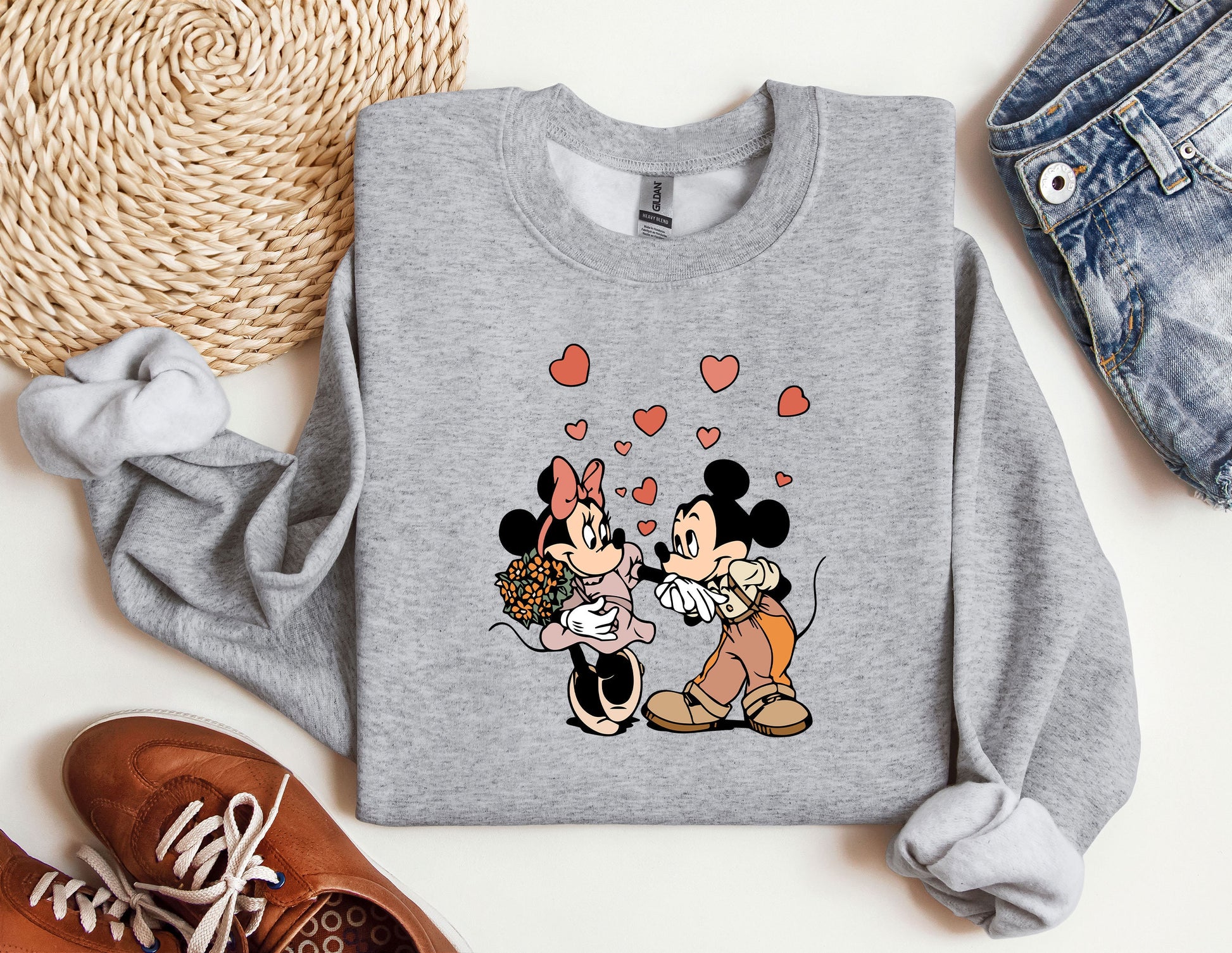 a couple of mickey and minnie mouse shirts