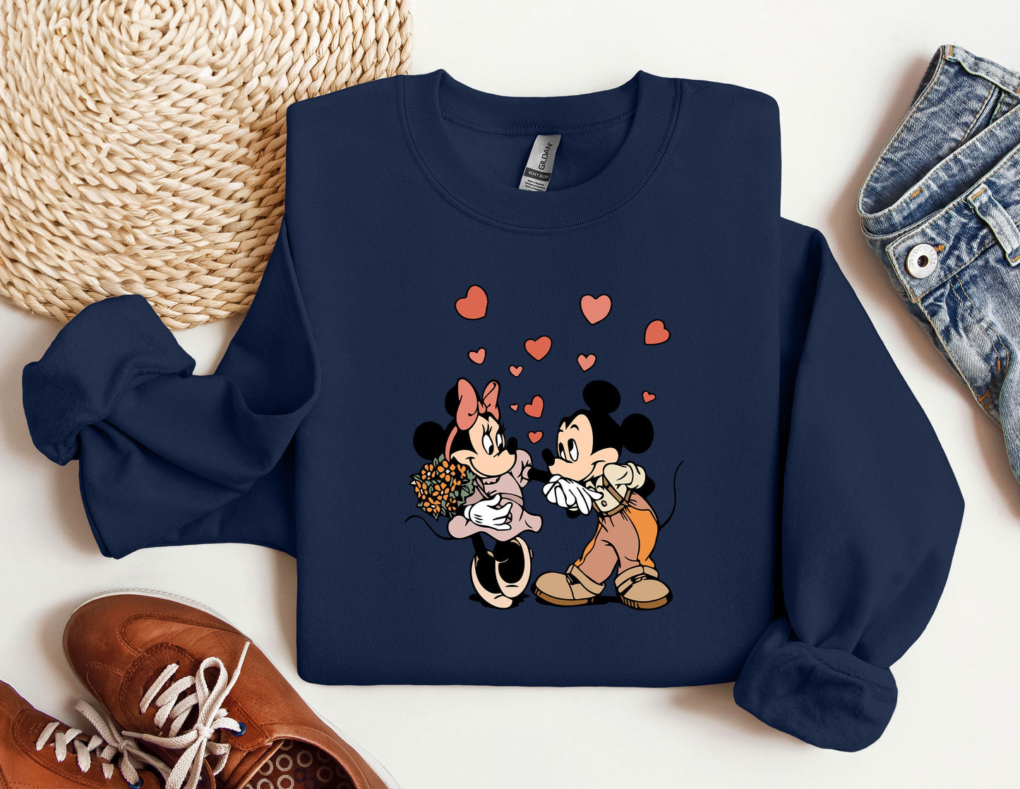 a couple of mickey and minnie mouse shirts