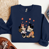 a couple of mickey and minnie mouse shirts