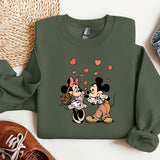 a couple of mickey and minnie mouse shirts