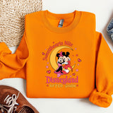 a mickey mouse shirt and a pair of sneakers