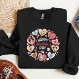 a black shirt with hearts and a pair of sneakers